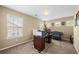 A functional office space featuring a desk, comfy chair, and lots of natural light at 1536 Fenmore St, Lithia Springs, GA 30122