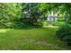 Backyard with lush grass and stone steps at 2 W Muscogee Nw Ave, Atlanta, GA 30305
