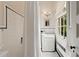 Charming bathroom featuring black and white tile and a pedestal sink at 2 W Muscogee Nw Ave, Atlanta, GA 30305