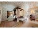 Bright bedroom with toile wallpaper, four poster bed, and neutral carpet at 2 W Muscogee Nw Ave, Atlanta, GA 30305
