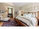Spacious bedroom features a dark rug, seating area, desk, and ample natural light at 2 W Muscogee Nw Ave, Atlanta, GA 30305
