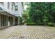 Stone driveway and lush garden area surround the exterior of home at 2 W Muscogee Nw Ave, Atlanta, GA 30305