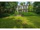Traditional home exterior with lush front yard and charming stone stairway at 2 W Muscogee Nw Ave, Atlanta, GA 30305