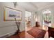 Stunning foyer with hardwood floors, an area rug, and sophisticated artwork at 2 W Muscogee Nw Ave, Atlanta, GA 30305