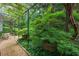 Green garden area with potted plants and seating area at 2 W Muscogee Nw Ave, Atlanta, GA 30305