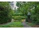 View of manicured garden with hedges and garden gazebo at 2 W Muscogee Nw Ave, Atlanta, GA 30305