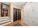 Hallway with staircase and beautiful, large built-in storage cabinet, perfect for organization and style at 2 W Muscogee Nw Ave, Atlanta, GA 30305