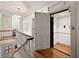 Hallway with staircase, chandelier, and elevator with open door at 2 W Muscogee Nw Ave, Atlanta, GA 30305