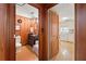 View from hallway into half bathroom and kitchen at 2 W Muscogee Nw Ave, Atlanta, GA 30305