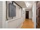 Basement hallway with electrical panel and several doorways, blending utility with practical design at 2 W Muscogee Nw Ave, Atlanta, GA 30305