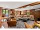 Spacious living room with wood paneling, hardwood floors, and ample seating at 2 W Muscogee Nw Ave, Atlanta, GA 30305