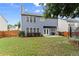Spacious backyard featuring a well-maintained lawn, patio, and play area, perfect for outdoor activities and relaxation at 2530 Vistoria Dr, Cumming, GA 30041
