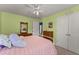 Bright bedroom with a double bed, carpet, and lots of natural lighting at 2530 Vistoria Dr, Cumming, GA 30041