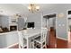 Dining room with a direct view of the fireplace with a table perfect for entertaining guests at 2530 Vistoria Dr, Cumming, GA 30041