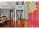Inviting foyer with hardwood floors, a decorative wreath, and a view into the dining area at 2530 Vistoria Dr, Cumming, GA 30041