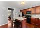 Well-equipped kitchen with stainless steel appliances, center island, and warm wood cabinetry at 2530 Vistoria Dr, Cumming, GA 30041