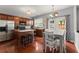 Well-lit kitchen with stainless steel appliances, stone countertops, kitchen island, and breakfast nook at 2530 Vistoria Dr, Cumming, GA 30041