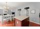 Bright kitchen featuring a center island, wood floors, and easy access to the dining area at 2530 Vistoria Dr, Cumming, GA 30041