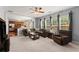 Open concept living room with carpet, a ceiling fan, and tons of natural light at 2530 Vistoria Dr, Cumming, GA 30041
