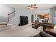 Spacious living room with staircase and access to the kitchen at 2530 Vistoria Dr, Cumming, GA 30041