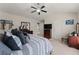 Spacious primary bedroom featuring a vaulted ceiling, ceiling fan and neutral color scheme at 2530 Vistoria Dr, Cumming, GA 30041
