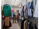 Organized walk-in closet with rods, shelves, and ample storage space for clothes and accessories at 2530 Vistoria Dr, Cumming, GA 30041