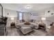 Finished basement living space has a large sectional sofa, wood floors, and neutral walls at 123 Mill Ln, Dallas, GA 30157