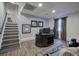 This finished basement is an office space featuring wood floors, neutral walls, and a dark wood desk at 123 Mill Ln, Dallas, GA 30157