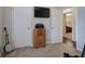 Bedroom view featuring a small banjo, vintage radio and doorway into the next room at 123 Mill Ln, Dallas, GA 30157