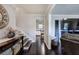 Inviting foyer with hardwood floors, decorative table, and staircase leading to the upper level at 123 Mill Ln, Dallas, GA 30157