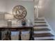 Welcoming foyer featuring a console table with decorative accents and a staircase at 123 Mill Ln, Dallas, GA 30157