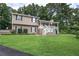 Charming two-story home featuring a welcoming front porch and a well-manicured front yard at 123 Mill Ln, Dallas, GA 30157