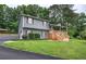 Inviting front exterior showcasing a well-maintained lawn and covered porch with newly stained wooden stairs at 123 Mill Ln, Dallas, GA 30157