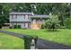 Charming two-story home with landscaped front yard and a unique, vine-covered mailbox at 123 Mill Ln, Dallas, GA 30157