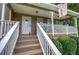 Inviting front porch featuring stylish railing and a charming space to sit and relax at 123 Mill Ln, Dallas, GA 30157