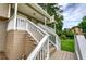 Inviting front porch with white railing and stairs leading to the front door at 123 Mill Ln, Dallas, GA 30157