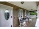 Inviting front porch with rocking chairs and a porch swing, creating a relaxing outdoor space at 123 Mill Ln, Dallas, GA 30157