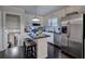 Well-appointed kitchen with stainless steel appliances, a center island, and dark hardwood floors at 123 Mill Ln, Dallas, GA 30157