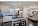 Bright kitchen with stainless steel appliances, a center island with seating, and dark hardwood floors at 123 Mill Ln, Dallas, GA 30157