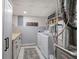 The finished basement has a laundry room with white cabinets and modern appliances at 123 Mill Ln, Dallas, GA 30157