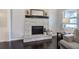 Elegant living room with stone fireplace and dark hardwood flooring, creating a cozy atmosphere at 123 Mill Ln, Dallas, GA 30157