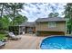 Backyard showcasing a refreshing pool and wooden deck, perfect for outdoor enjoyment and relaxation at 123 Mill Ln, Dallas, GA 30157