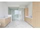 Spacious bright bathroom features white marble floors and sink vanities on each side at 2425 Peachtree Ne Rd # 1503, Atlanta, GA 30305