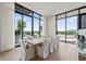 Elegant dining room with floor-to-ceiling windows, a large table with seating for ten, and great views at 2425 Peachtree Ne Rd # 1503, Atlanta, GA 30305