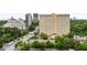 High-rise building with lush landscaping and a pool in an urban setting at 2425 Peachtree Ne Rd # 1503, Atlanta, GA 30305