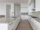 Elegant kitchen with white cabinetry, marble countertops, and an open layout, perfect for cooking and entertaining at 2425 Peachtree Ne Rd # 1503, Atlanta, GA 30305