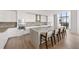 Stunning kitchen with white cabinetry, stainless steel appliances, and a large center island with breakfast bar seating at 2425 Peachtree Ne Rd # 1503, Atlanta, GA 30305