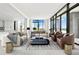 Bright living room featuring stylish furnishings, floor-to-ceiling windows and access to the outside terrace at 2425 Peachtree Ne Rd # 1503, Atlanta, GA 30305