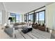 Bright and airy living room with floor-to-ceiling windows and sophisticated decor for upscale living at 2425 Peachtree Ne Rd # 1503, Atlanta, GA 30305