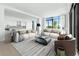 Spacious living room with an open floor plan, modern decor, and abundant natural light from large windows at 2425 Peachtree Ne Rd # 1503, Atlanta, GA 30305